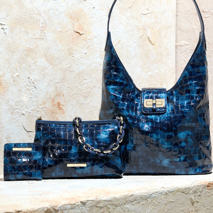 Brahmin blue croc embossed leather collection featuring a hobo shoulder bag, chain strap handbag and matching compact wallet
