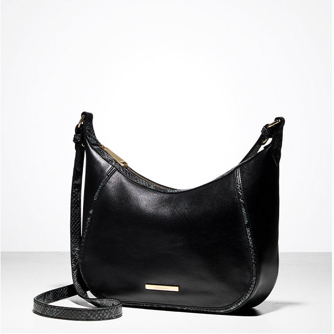 Black Brahmin crossbody bag with smooth leather finish and subtle croc-embossed trim, shown on a white background.