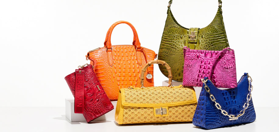 Collection of colorful handbags on a white background