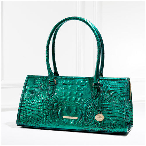 Green metallic Brahmin Sophia croc-embossed satchel with double handles photographed against a clean white backdrop.