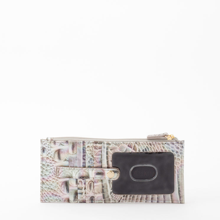 BRAHMIN Credit Card Wallet in pastel hues, featuring embossed textured pattern, rectangular silhouette, zippered top with gold-tone pull, black accent patch; shown on white background.