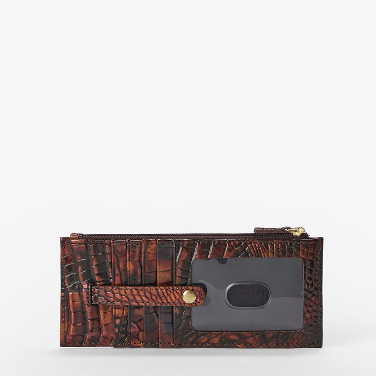 A brown crocodile-embossed leather zip-around wallet with a dark gray card holder and a small gold snap button, shown against a plain white background.