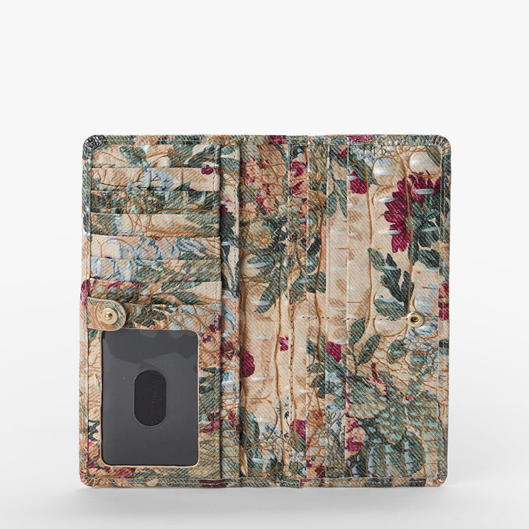 A vintage-style floral wallet or card holder with a multi-compartment interior, featuring a beige background with green leaves and red flowers, and a clear ID window on the front.