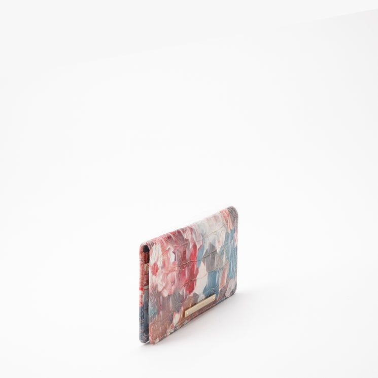 BRAHMIN Ady Wallet displayed upright on a white background, features a vibrant abstract floral print, multiple visible credit card slots, gold-tone zip pocket, and slim rectangular silhouette.