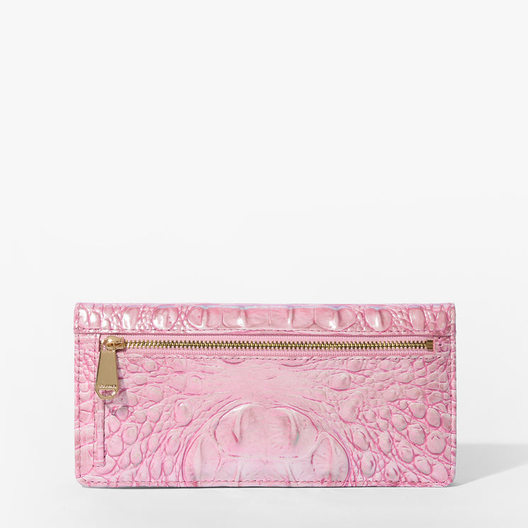 Brahmin pink embossed leather wallet with textured pattern, featuring a front zipper pocket and gold-tone zipper pull, displayed on a white background. Compact silhouette with elegant hardware details.