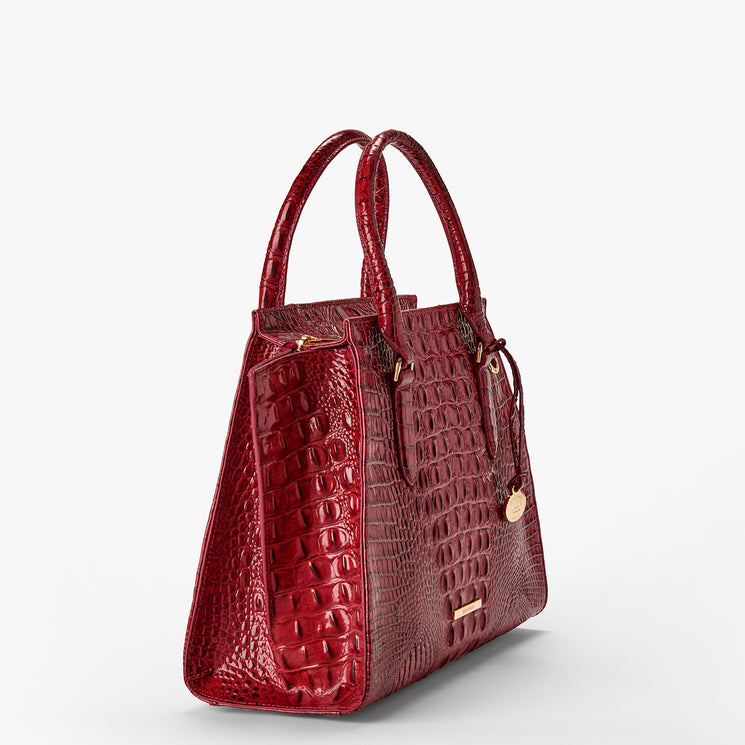 Volcanic Red Melbourne croc textured handbag on a light gray background. Priscilla Satchel side view.