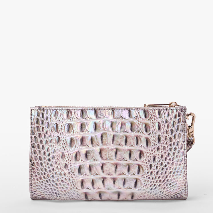 Brahmin metallic iridescent clutch with embossed textured pattern, structured silhouette, zipper closure, small side clasp, and no visible strap. Displayed on a white background. Front angle shows exterior details.