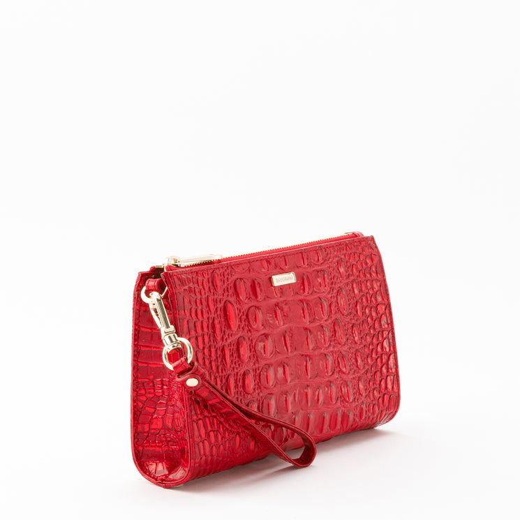 Brahmin Daisy wristlet in Tinsel Red with an embossed texture, gold-tone hardware, and a detachable strap.