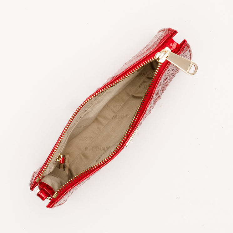 Brahmin Daisy slim rectangular pouch in Tinsel Red with an embossed texture, gold-tone zipper, and overhead view showing the interior lining.
