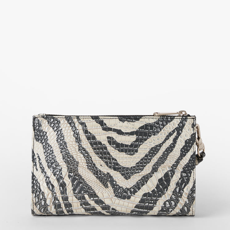 Brahmin clutch purse in a rectangular silhouette with black and white zebra-inspired textured pattern, crocodile-embossed surface, no visible hardware, shown closed on a plain white background.