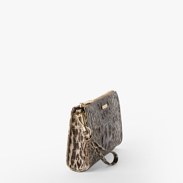 Leopard print clutch bag with gold accents on a white background. Daisy side view.