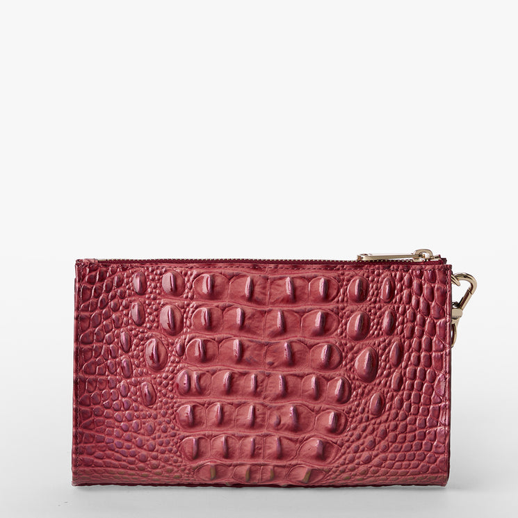 Brahmin small rectangular wallet in maroon with embossed textured pattern, top zipper closure, gold-tone side clasp, set on a white background. No strap visible; front and hardware details shown.