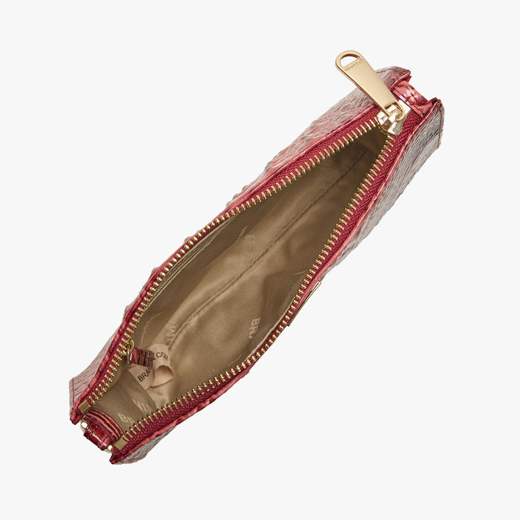 Brahmin red textured clutch with gold zipper, shown open from above. Features a beige fabric-lined interior with a small inner pocket. Silhouette is rectangular; photographed on a white background.