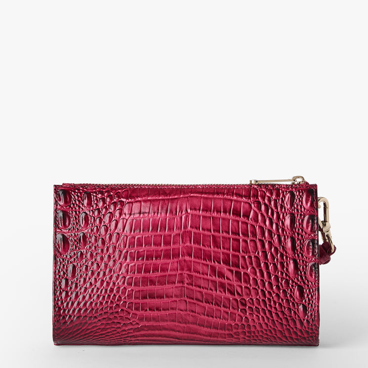 Brahmin rectangular clutch purse in shiny, textured dark pink with an embossed pattern, gold-tone zipper hardware, and no visible strap, shown against a plain white background.