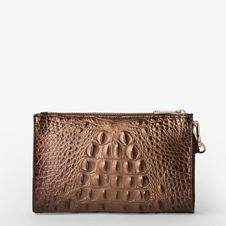 Brahmin brown wallet with embossed textured finish, gold zipper closure, and right-side clasp, rectangular silhouette, shown on a plain white background. No strap or interior details visible in this view.