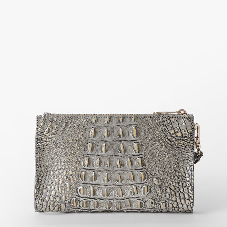 Brahmin clutch in small rectangular silhouette with gray embossed texture, gold zipper closure, and side chain loop. Displayed against a plain white background, showcasing compact shape and hardware details.