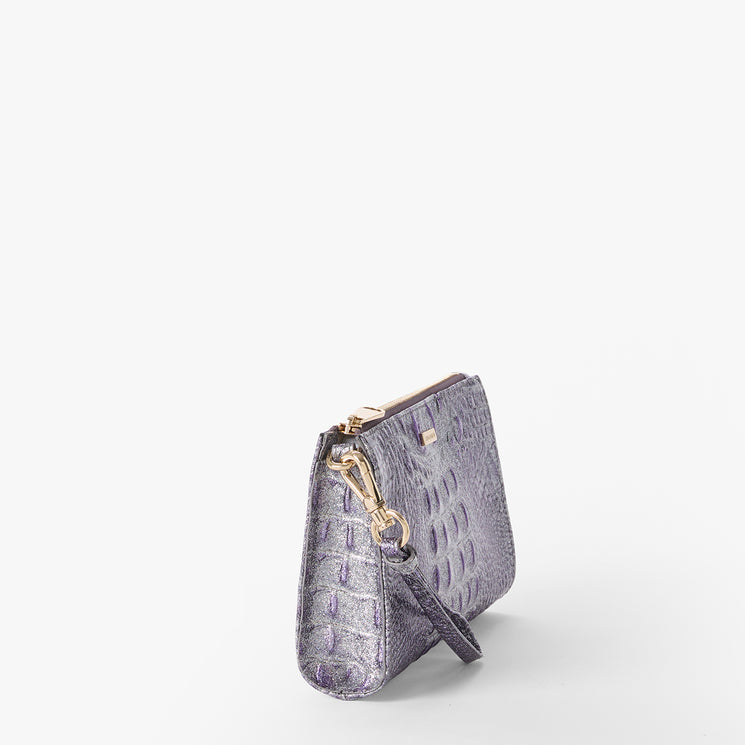Brahmin purple textured clutch handbag with gold-tone clasp, detachable wrist strap, and upright silhouette on a white background. Features small size and embossed pattern, shown in front view with secure hardware.