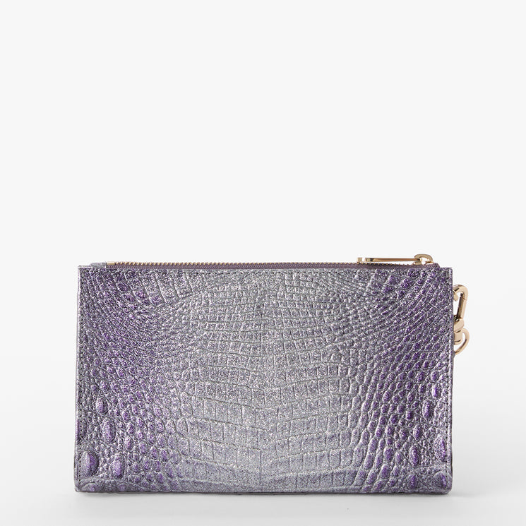 Brahmin metallic purple clutch with embossed texture, rectangular silhouette, gold zipper closure, and gold hardware clip on one side. Shown against a plain white background.