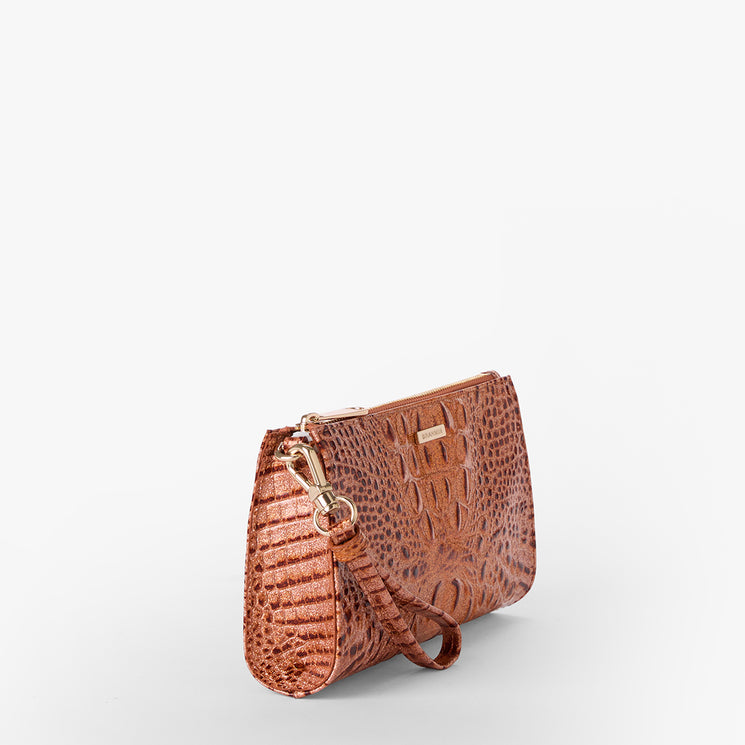 Brahmin brown embossed clutch bag with wrist strap, gold-tone hardware, zip closure, and textured pattern. The rectangular silhouette is shown on a white background; exterior branding visible near the top.