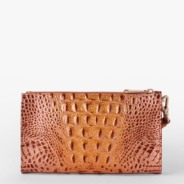 Brahmin small wallet in metallic copper with embossed reptile-inspired textured finish, glossy shine, compact silhouette, and minimal hardware, displayed on a plain white background.