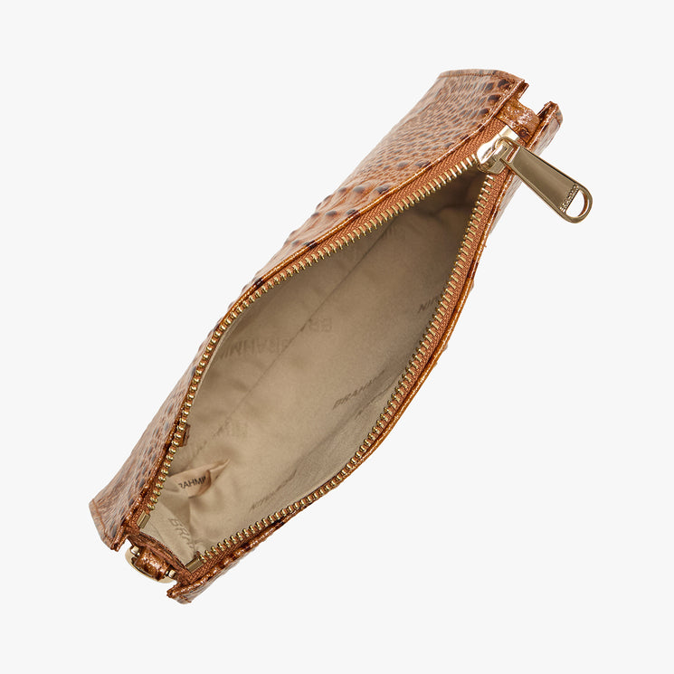 Brahmin brown textured leather pouch with gold-tone zipper, open to show light beige fabric lining. Top-down view highlights compact silhouette and structured shape on a white background. No strap visible.