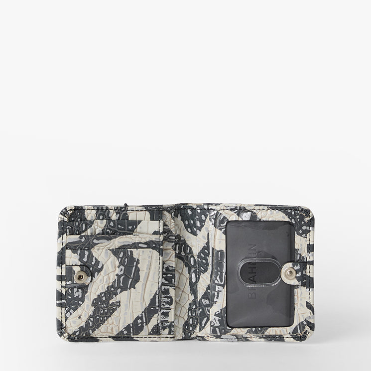 Brahmin small open wallet in black and white with abstract pattern, buttoned coin pocket, transparent ID window, card slot, compact silhouette; shown on plain white background.
