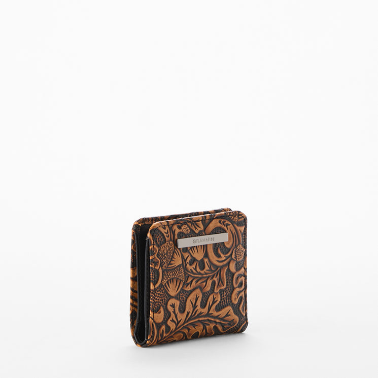 Brown leather wallet with intricate pattern on a white background. Jane wallet side view.