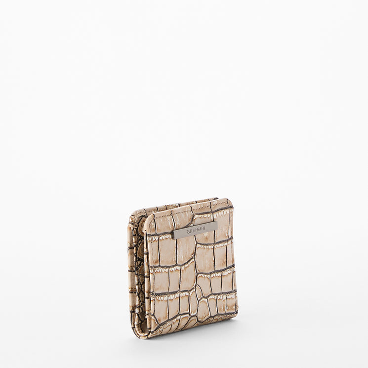 Beige textured cardholder on a white background. Jane side view.