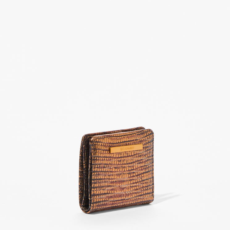 A textured brown and black leather bifold wallet with a small gold-tone Brahmin accent bar on the front, shown on a clean white background.