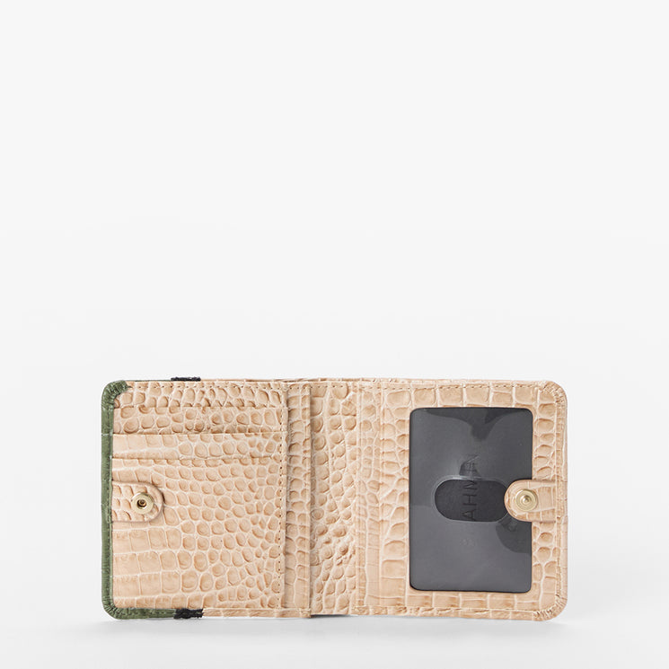 An open beige crocodile-embossed leather wallet with a clear ID window and gold-tone snap buttons, shown against a plain white background.