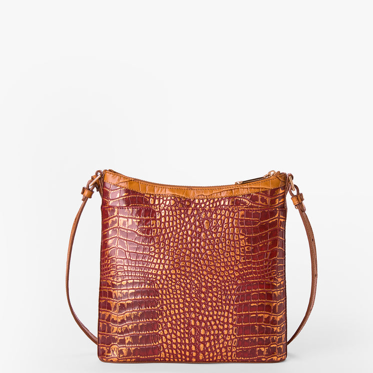 A brown crocodile-embossed leather shoulder bag with a top zipper and a thin matching leather strap, shown against a plain white background.