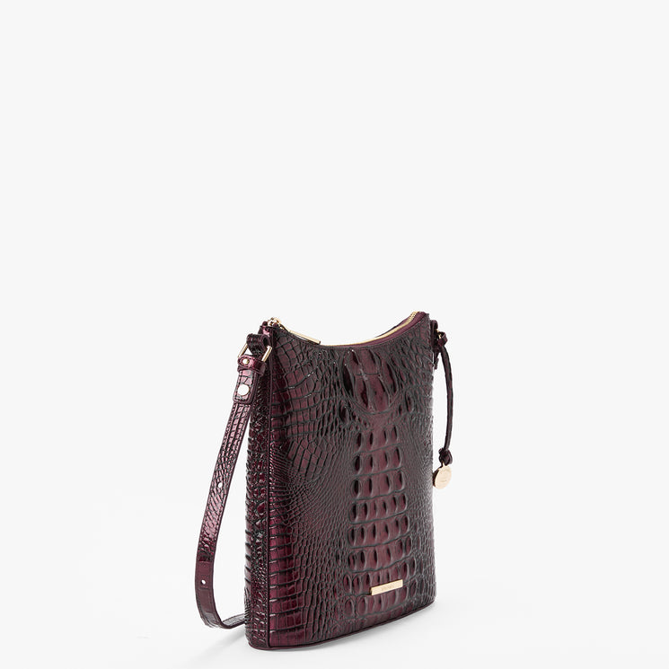 A dark burgundy crocodile-embossed leather shoulder bag with gold-tone hardware, shown from a three-quarter angle against a plain white background.