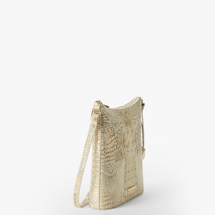 Brahmin cream-colored crossbody bag with an embossed textured pattern, zippered top closure, gold-tone hardware, and adjustable strap. Bag is angled to show the silhouette against a plain white background.