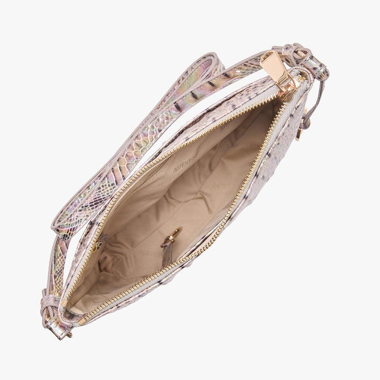 Open top view of a Brahmin metallic textured shoulder bag with gold-tone zipper, beige interior lining, small keyring clip, and matching strap. Features embossed snakeskin-inspired pattern and organized compartment.