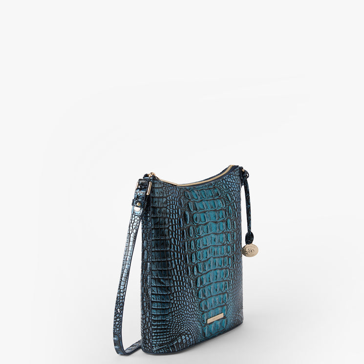Brahmin small teal crossbody bag with embossed texture, structured silhouette, slim adjustable strap, and gold-tone logo tag. Displayed on a plain white background, showing the front and strap details.