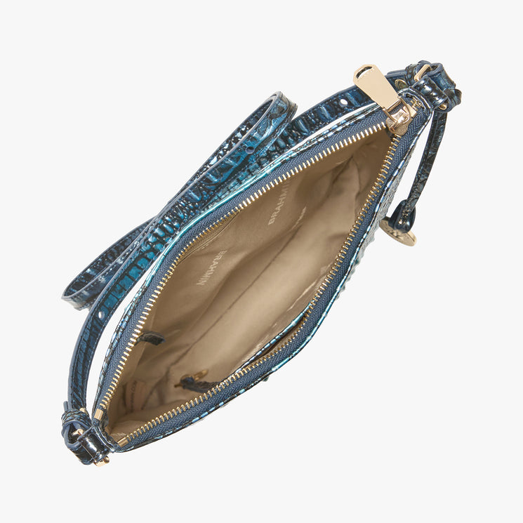 Brahmin blue textured handbag with gold zipper, slim strap, and gold hardware, shown open to reveal beige lining and a small inside pocket; croc-embossed pattern enhances structured silhouette.