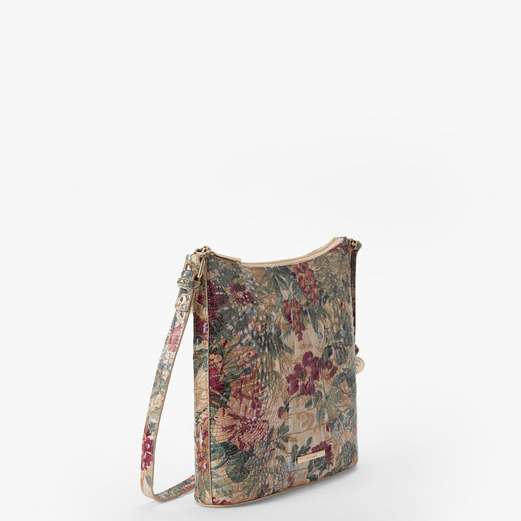 A small shoulder bag with a vintage floral tapestry pattern in muted red, green, and beige tones, featuring a matching patterned strap and gold-tone hardware, shown on a plain white background.