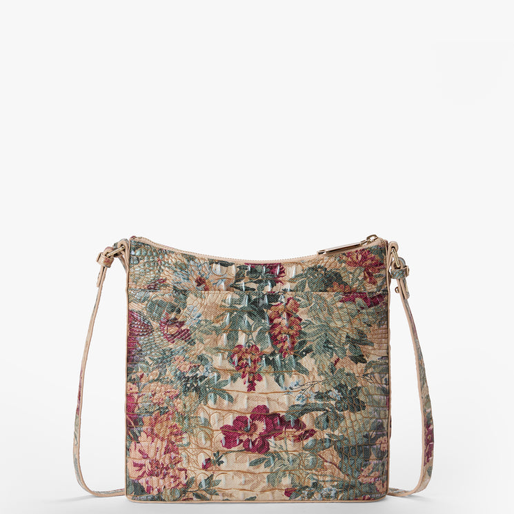 A vintage-style floral tapestry crossbody bag with a woven basketweave texture, featuring a multicolor floral pattern in red, green, and beige, with a matching beige shoulder strap, shown against a plain white background.