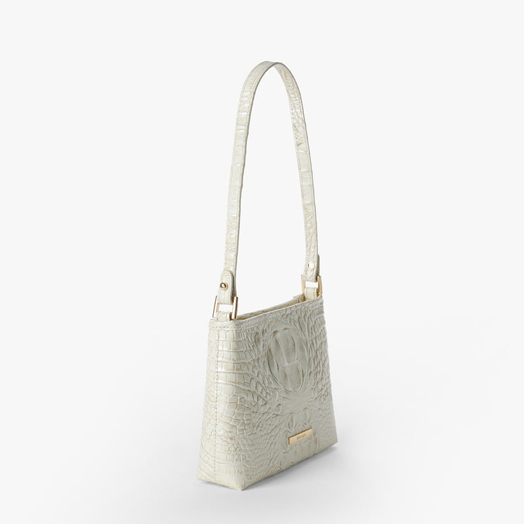 Brahmin small rectangular cream handbag, embossed crocodile pattern, short top handle, gold-tone hardware, displayed on a white background. Structured silhouette with visible texture and elegant finish.