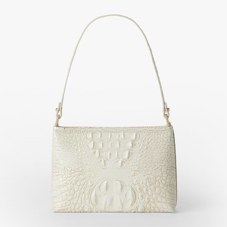 Brahmin cream handbag with embossed crocodile-inspired texture, structured rectangular silhouette, single top handle, gold-tone hardware, shown against a plain white background.