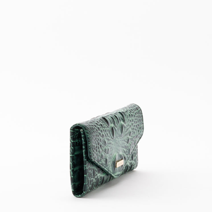 Dark green Veronica envelope wallet by Brahmin featuring a croc-embossed texture and a small gold-tone metal accent.