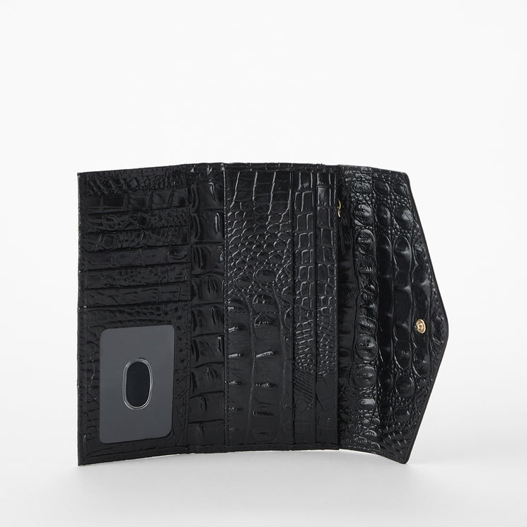 Brahmin wallet with leopard print and black and red leather accents on a white background. Veronica open view.