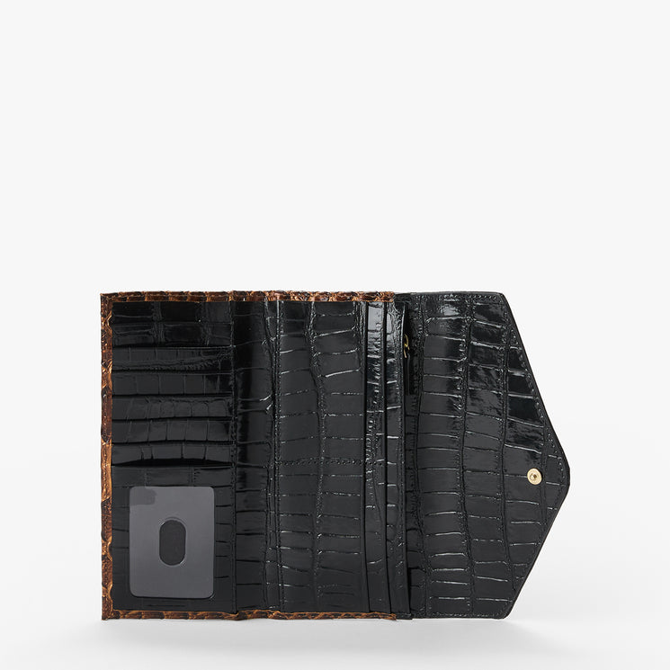A black crocodile-embossed wallet shown open, featuring multiple card slots, a glossy black interior, and a brown patterned lining visible along the edges, set against a plain light gray background.