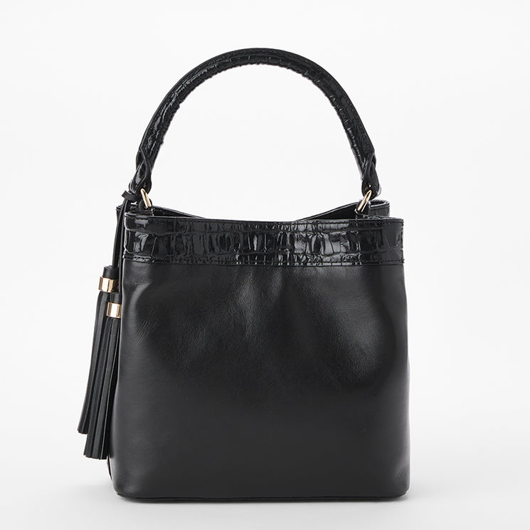 Brahmin black handbag with textured handle and trim, gold-tone hardware, and a large tassel accent. Structured silhouette shown against a white background.