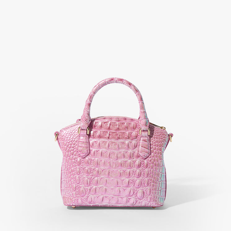 Brahmin Mini Misha top-handle bag in pink with embossed texture, gold-tone hardware, and a structured silhouette. Two handles shown, set against a white background. No strap or interior details visible.