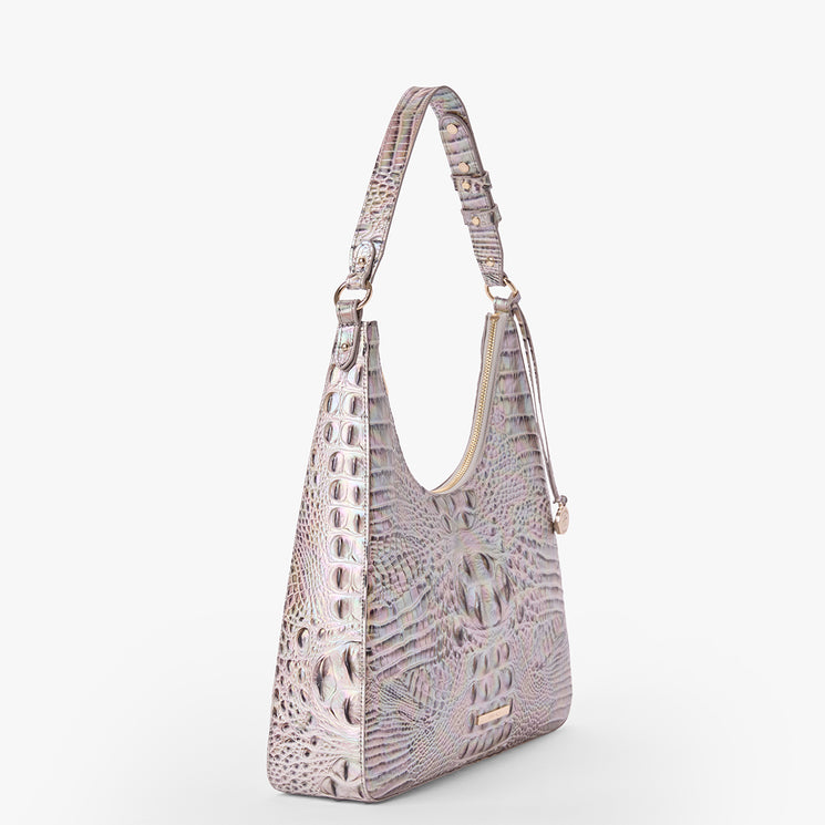 Brahmin iridescent shoulder bag with crocodile-embossed pattern, curved top silhouette, single adjustable strap, and gold-tone hardware, shown on a plain white background.
