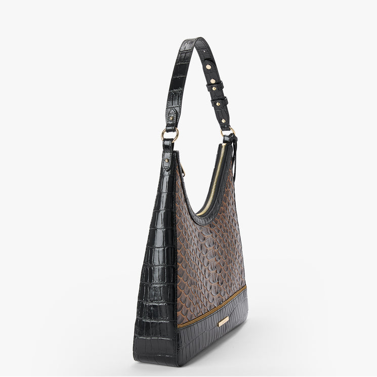 A structured shoulder bag with a split design: one half features a glossy black crocodile-embossed texture, and the other half has a brown and black reptile-patterned body. It has a single shoulder strap with gold-tone rivets and a gold zipper closure.