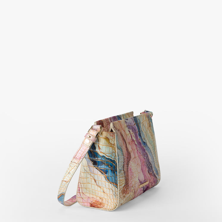 Multicolored marble-patterned handbag on a white background. Hillary side view.