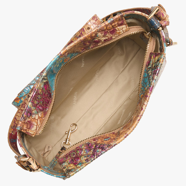 Brahmin handbag with vibrant textured exterior, tan fabric lining, gold-tone zipper hardware, inner zip pocket, key clip; top view with open zipper reveals spacious interior and organized compartments.