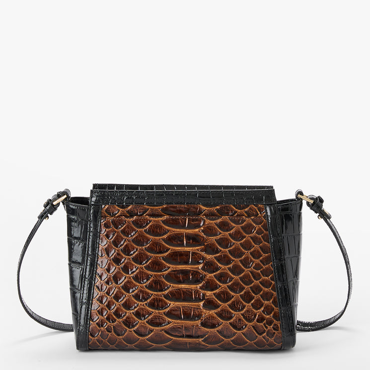 A structured handbag featuring a brown snake-patterned front panel and black crocodile-embossed side panels and strap, shown against a plain light gray background.